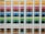 A neatly organized assortment of colorful paper sheets is displayed on shelves. Each row contains papers of a different color, forming a gradient from light to dark shades. The shelves are structured in columns, creating a visually appealing and orderly arrangement.