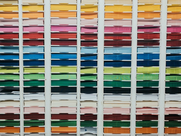 Organized variety of paper products and small retail items on display.