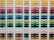 A neatly organized assortment of colorful paper sheets is displayed on shelves. Each row contains papers of a different color, forming a gradient from light to dark shades. The shelves are structured in columns, creating a visually appealing and orderly arrangement.