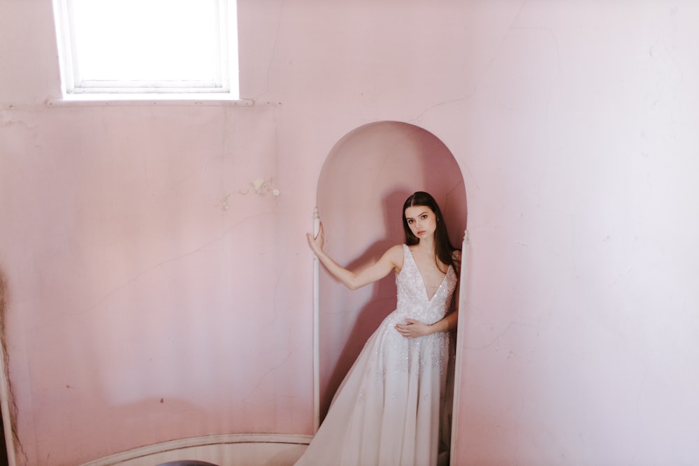 woman in white dress standing on bathtub