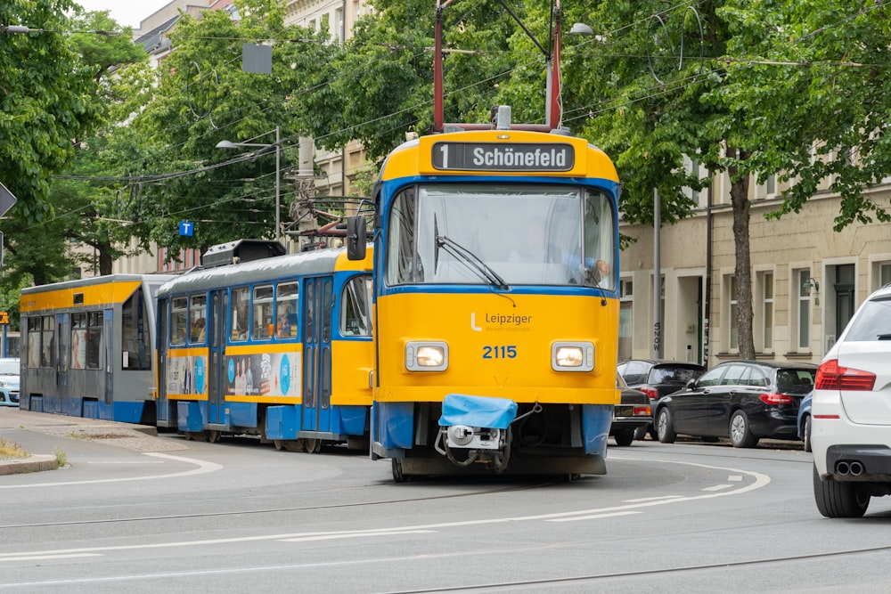 yellow and blue tram on road during daytime