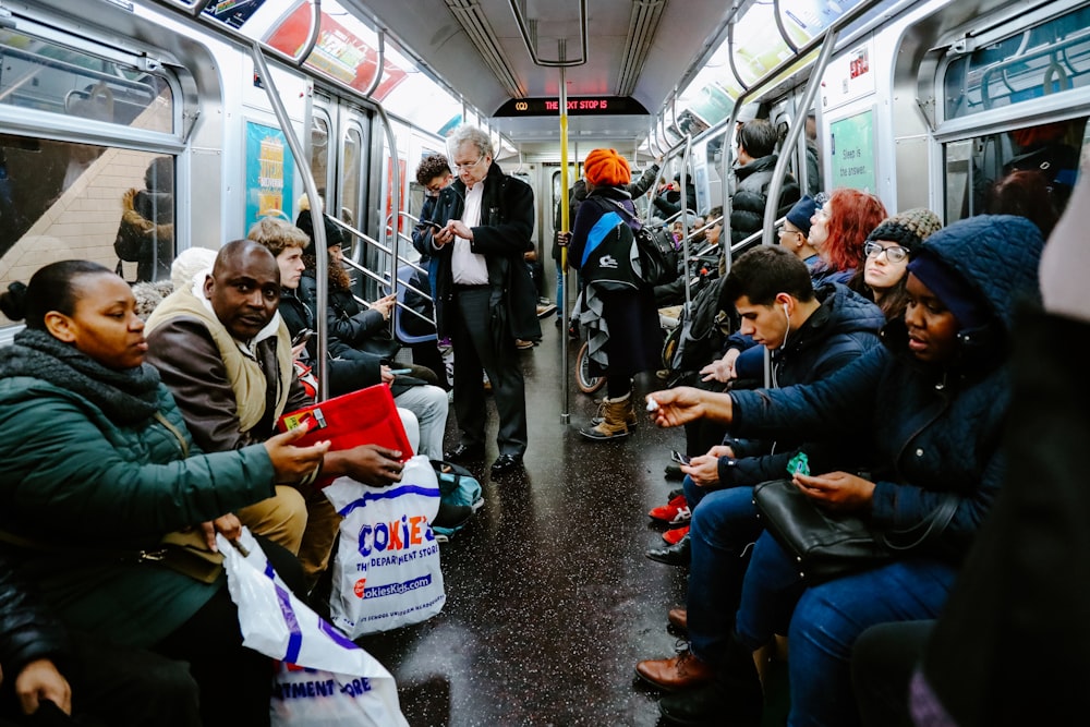 people sitting on train seat