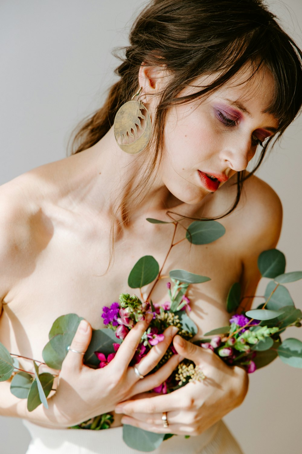 woman with flower on her ear