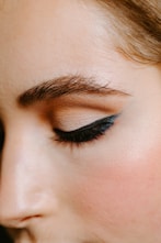 woman with red lipstick and black mascara