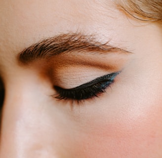 woman with red lipstick and black mascara