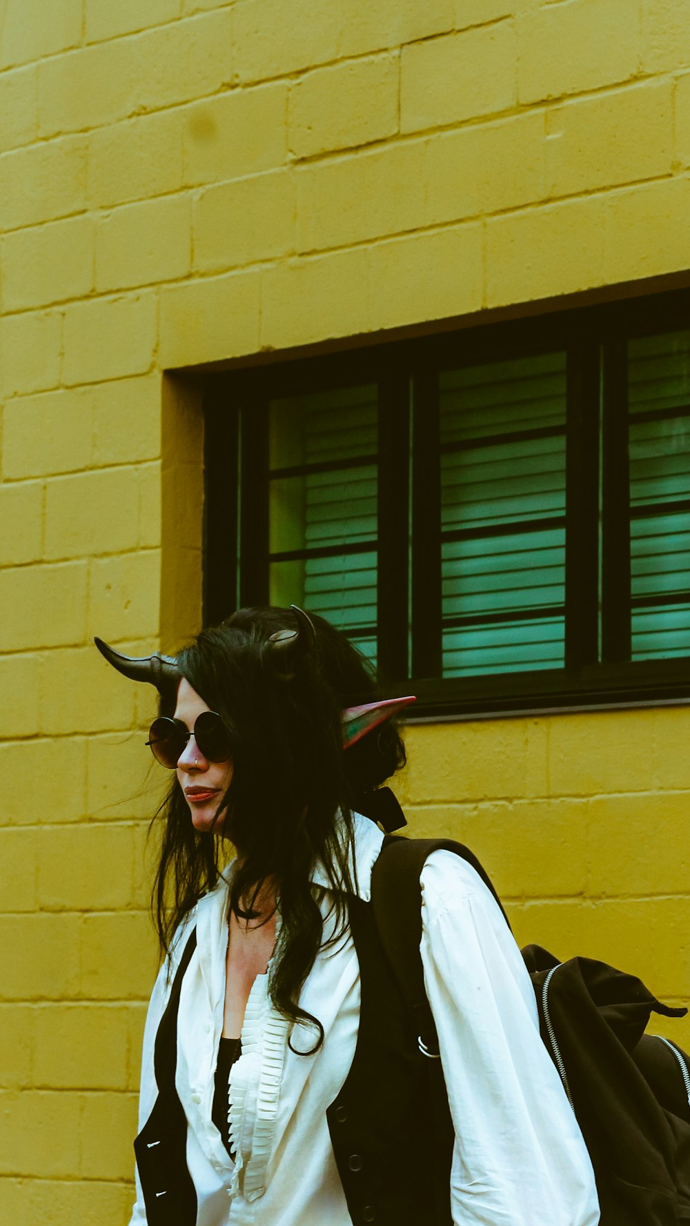 woman in white shirt wearing black sunglasses