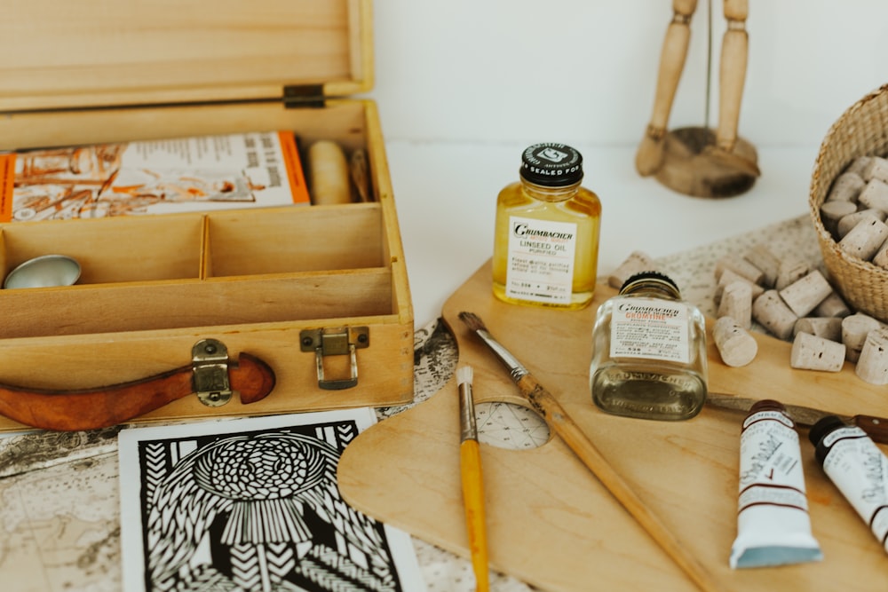 assorted bottles on brown wooden box