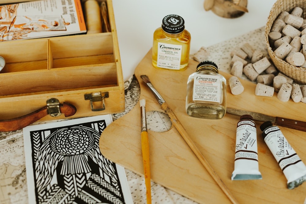 clear glass bottle on brown wooden table