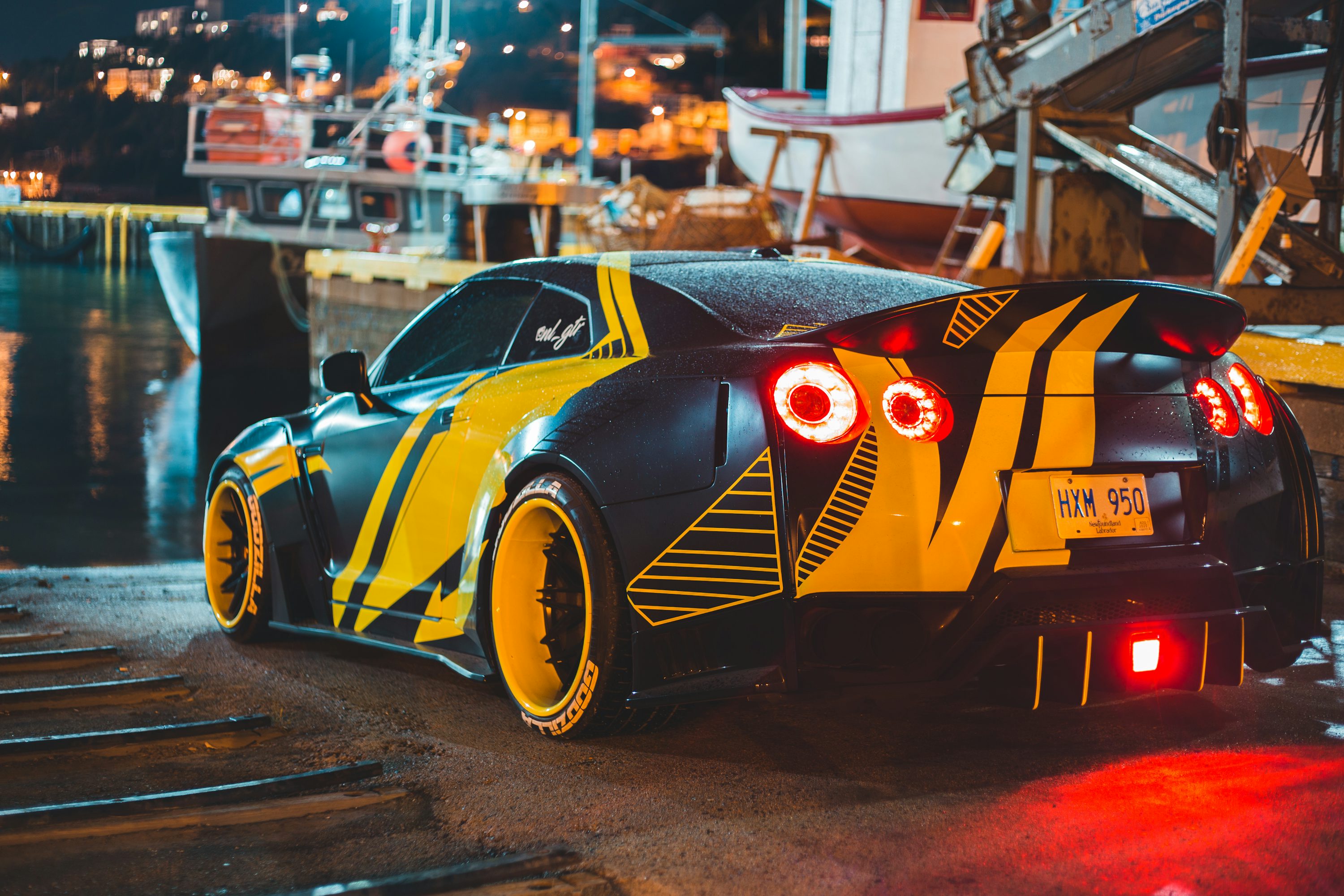 yellow and black lamborghini parked on parking lot