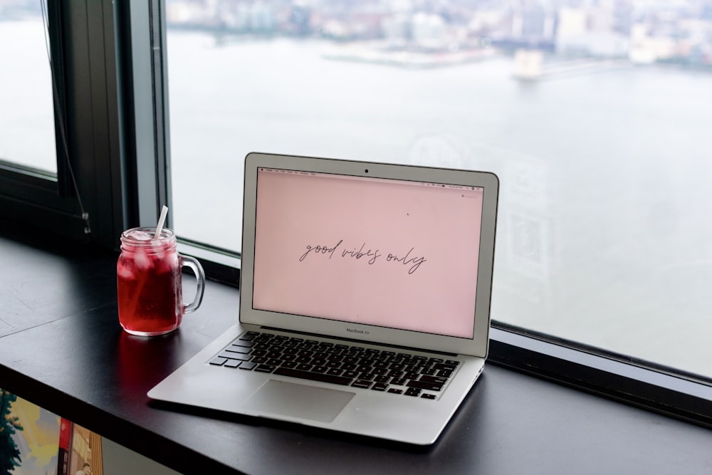 macbook air on black table photo – Free Computer Image on Unsplash