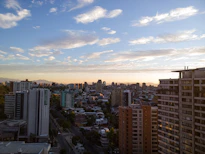 A panoramic view of a city skyline at sunset, highlighting urban living.