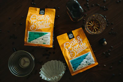 An assortment of Awfeee coffee packets displayed on a rustic wooden table.