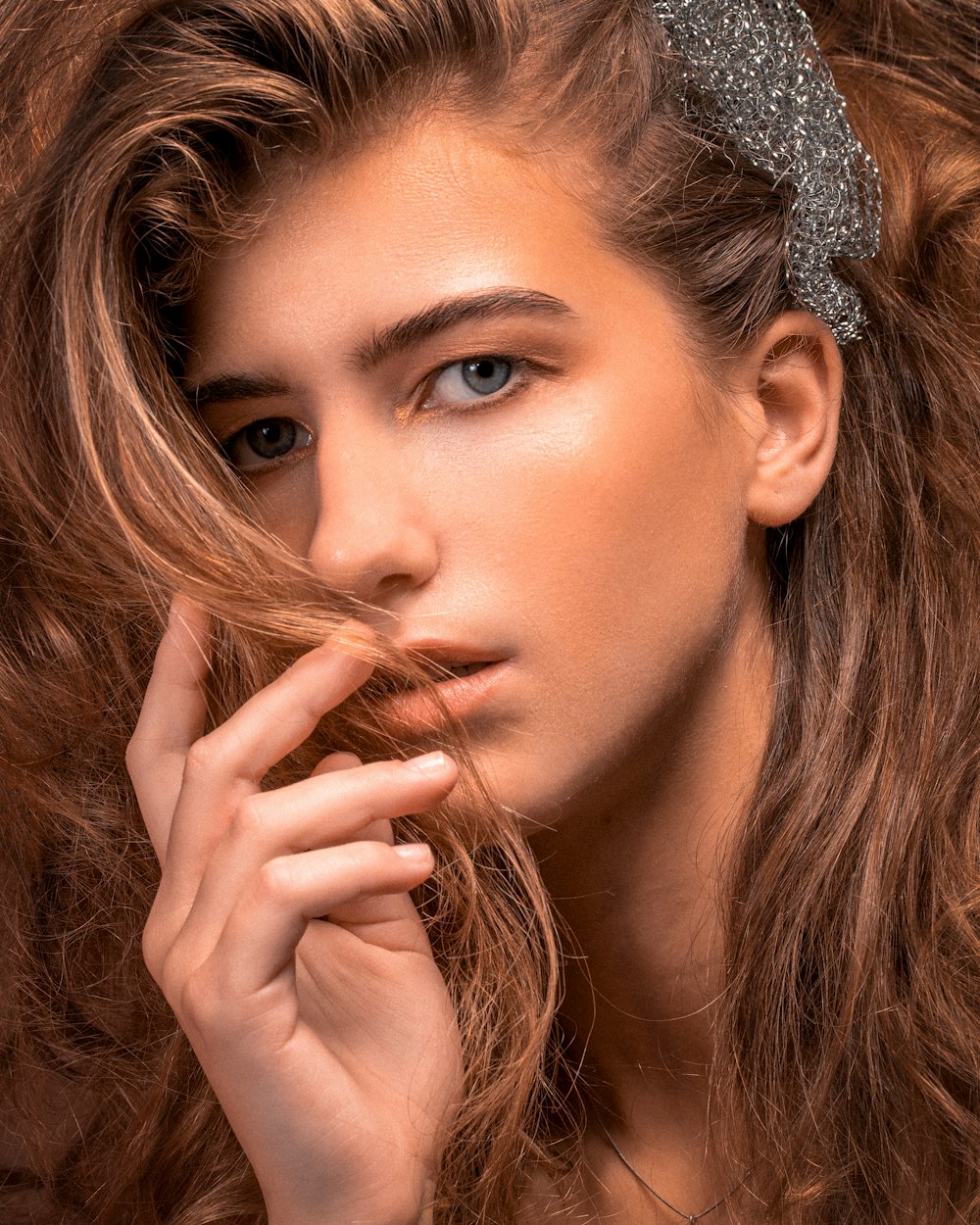 woman with silver floral headband