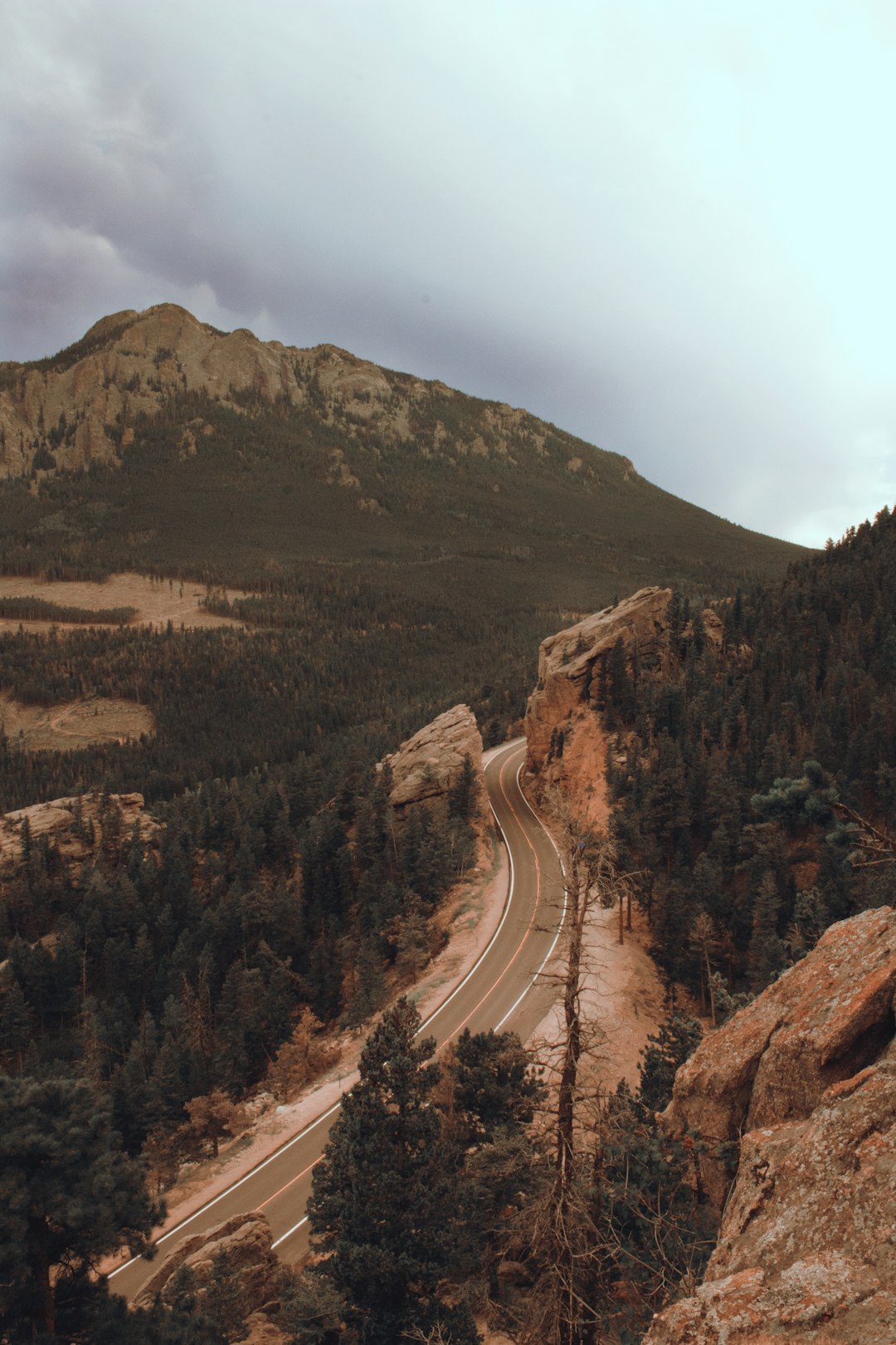 aerial view of road between mountains during daytime