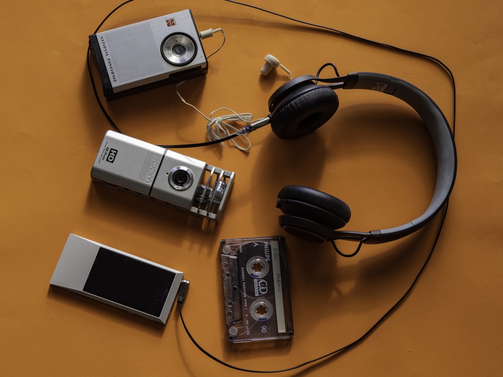 black headphones on brown wooden table