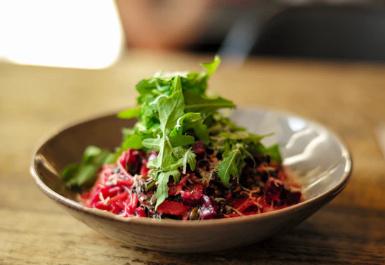 vegetable salad on brown ceramic bowl
