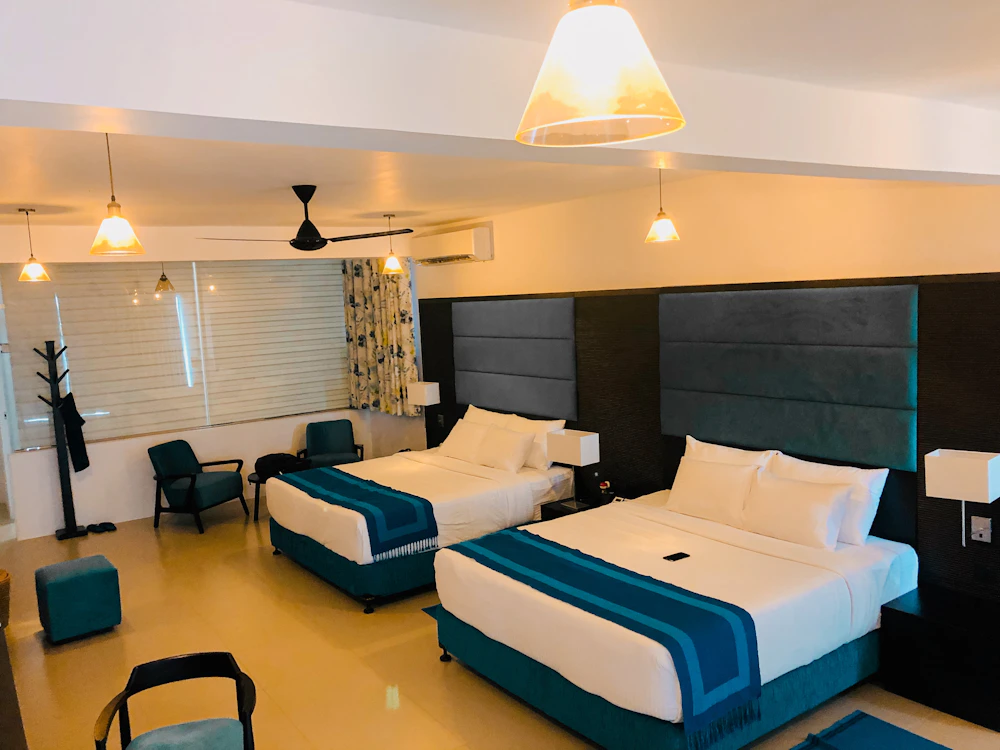 Twin hotel room with soft neutral design