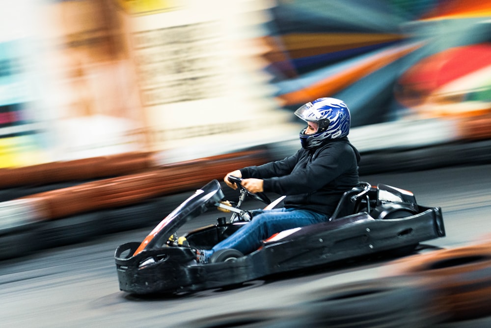 man riding on go kart