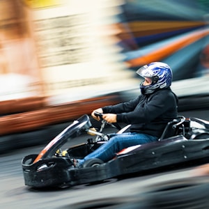 man riding on go kart