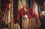 Close-up of colorful handcrafted beaded necklaces laid out on a cozy fabric.
