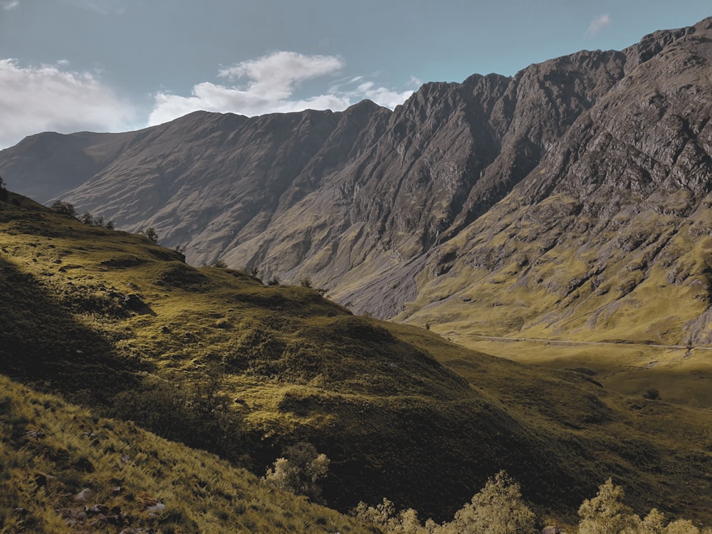 green and brown mountains under blue sky during daytime