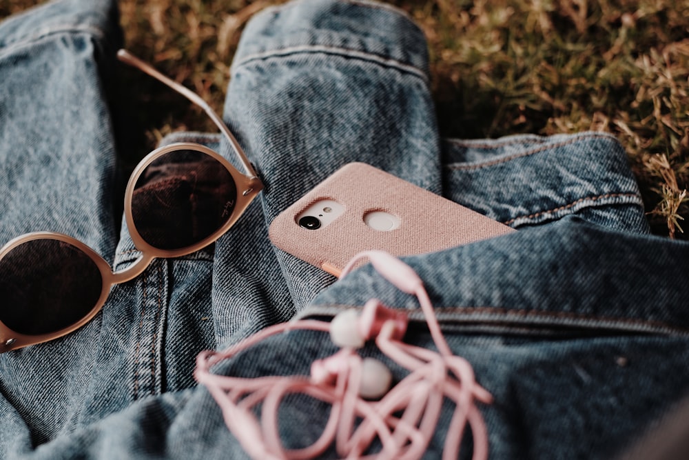 silver iphone 6 on blue denim jeans