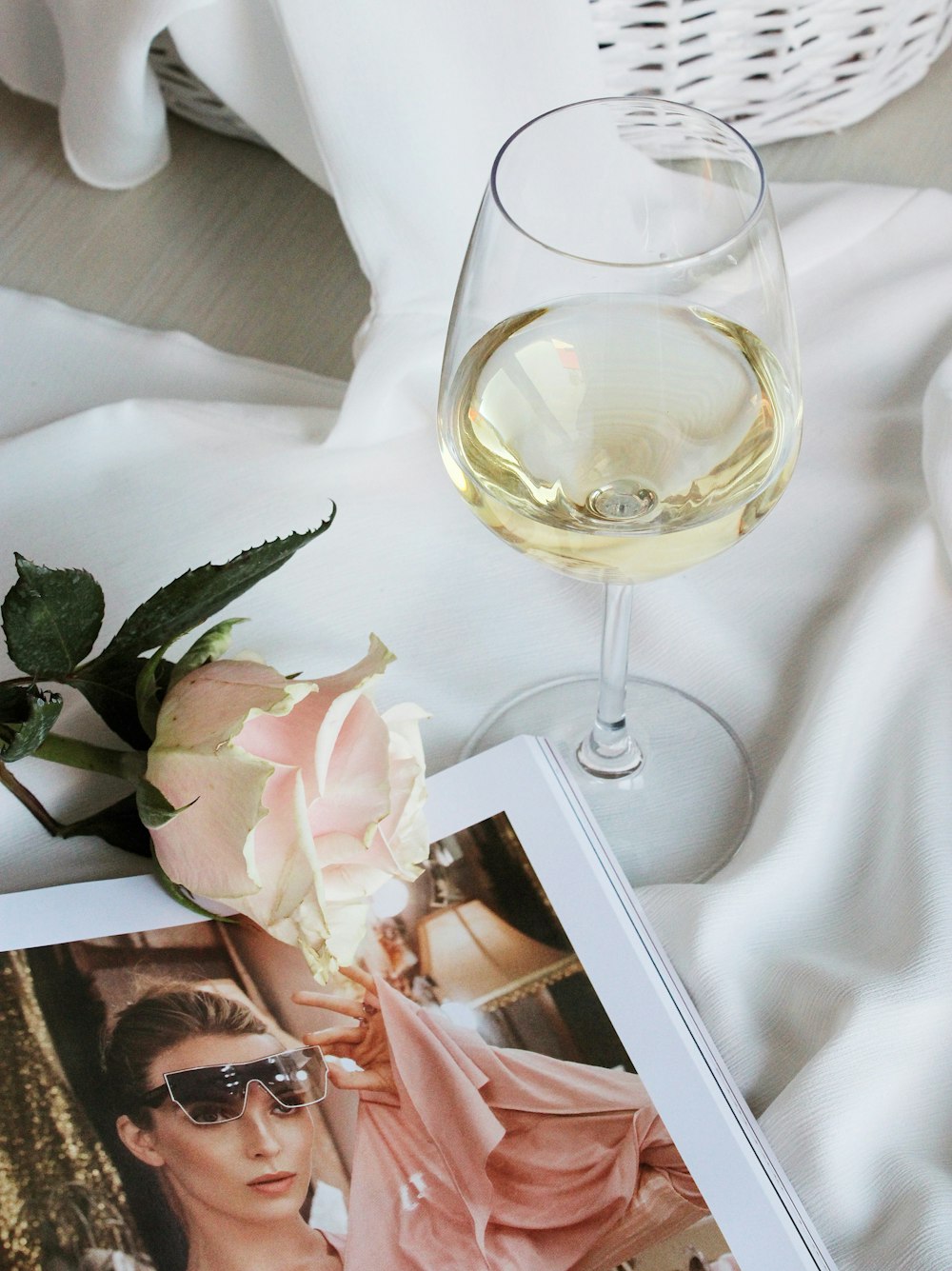 clear wine glass on white textile