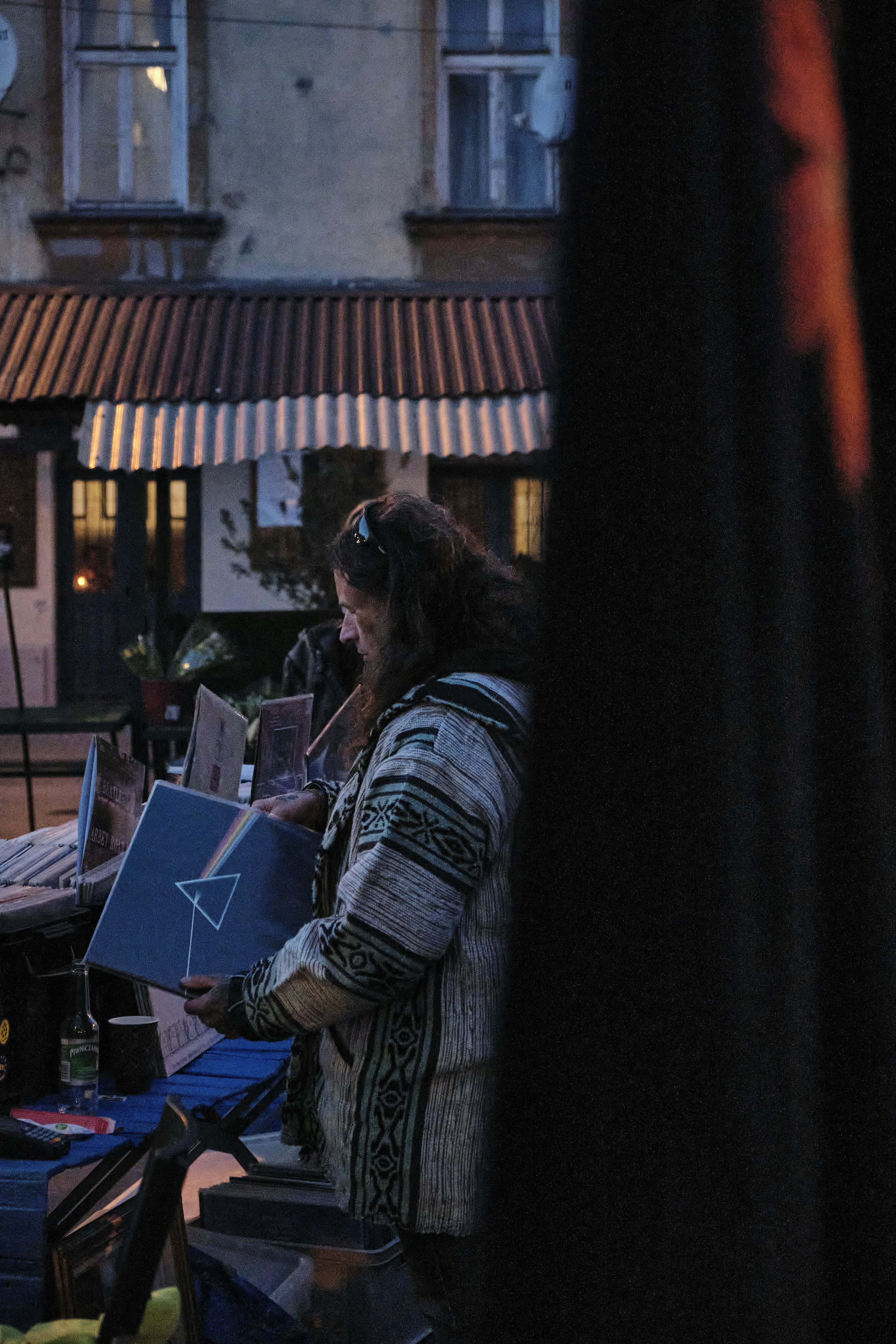 woman in black and white striped long sleeve shirt sitting on chair