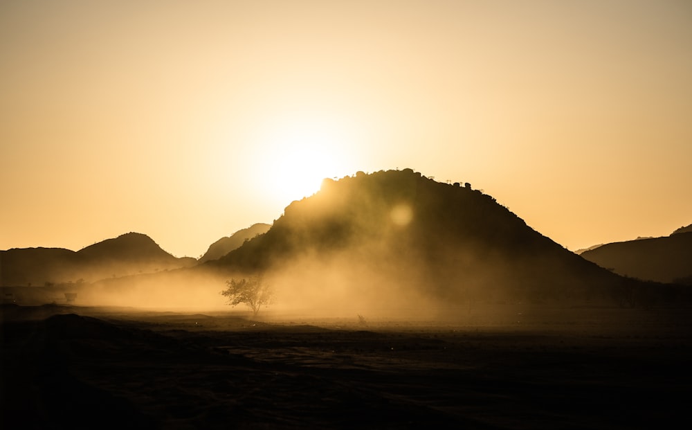 silhouette of mountain during foggy day