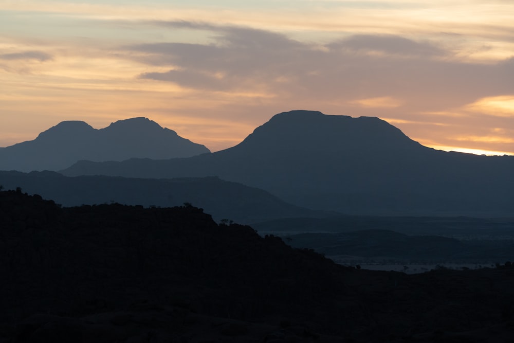 silhouette of mountains during sunset