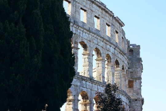 brown concrete building during daytime in Pula Croatia