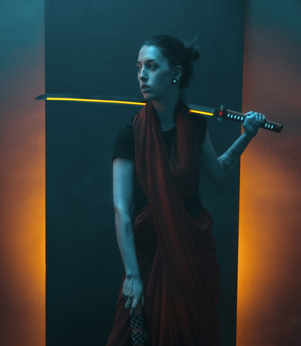 woman in black sleeveless dress holding microphone