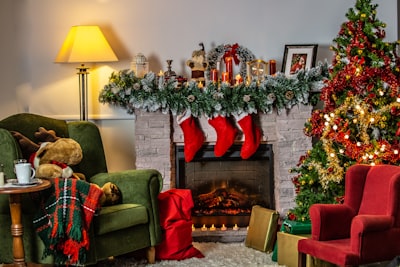 green sofa chair beside green christmas tree stocking stuffer google meet background