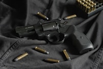 black and silver revolver pistol