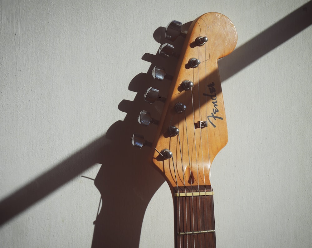 brown and black acoustic guitar