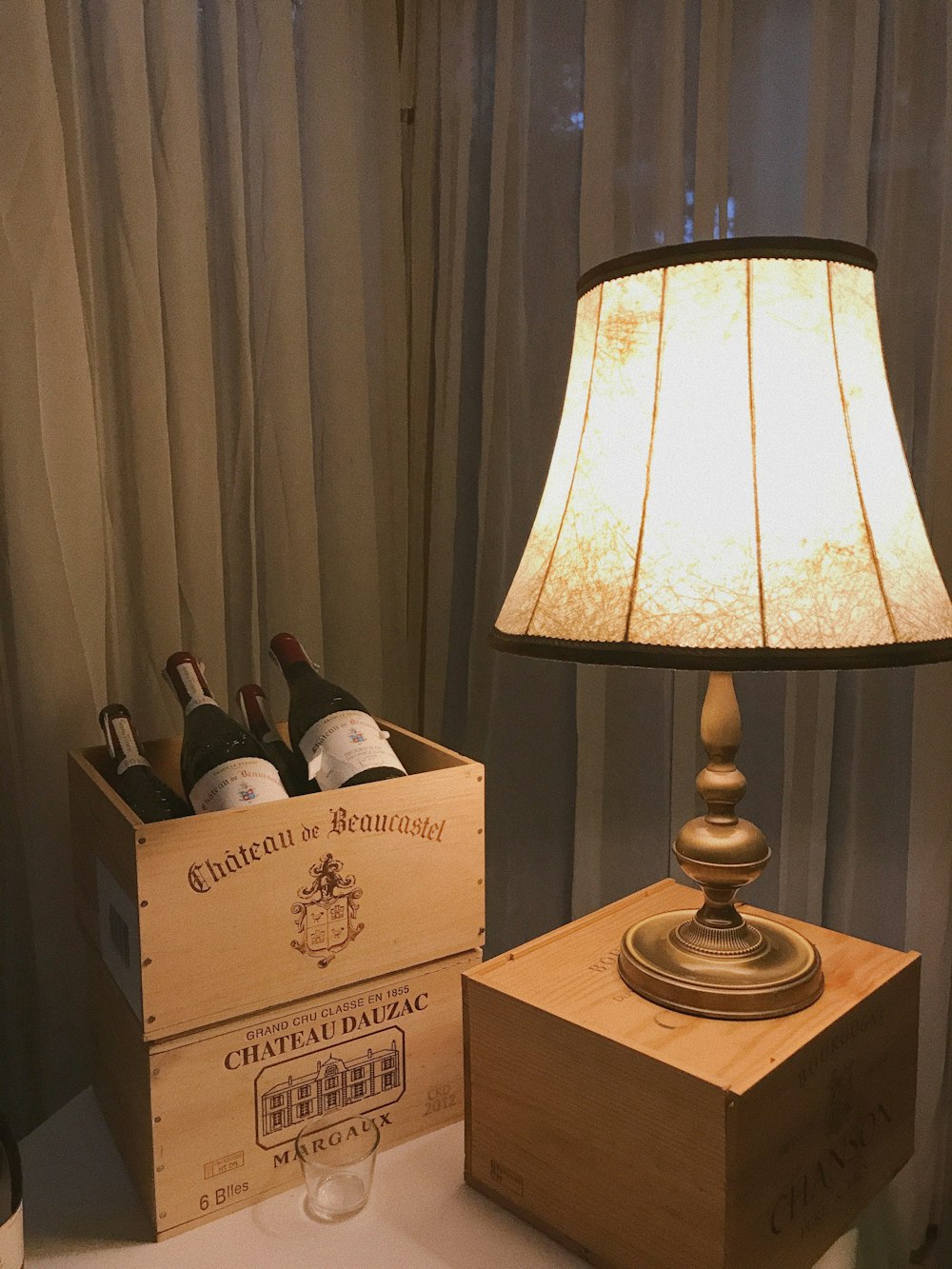 brown wooden box with white table lamp