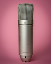 black microphone on pink background