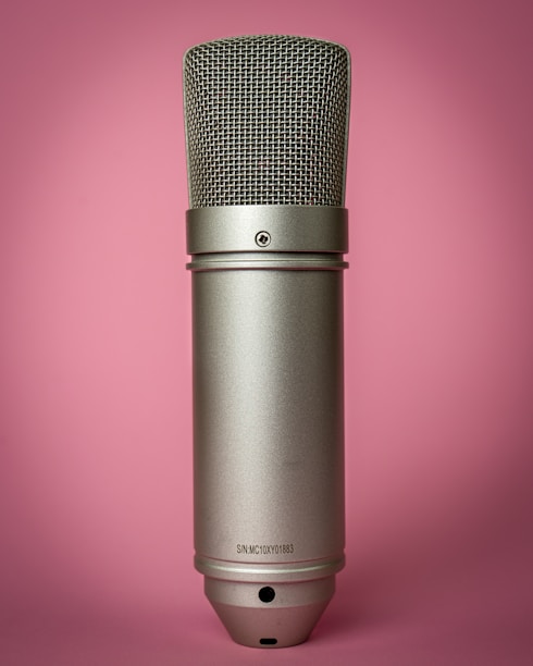 black microphone on pink background