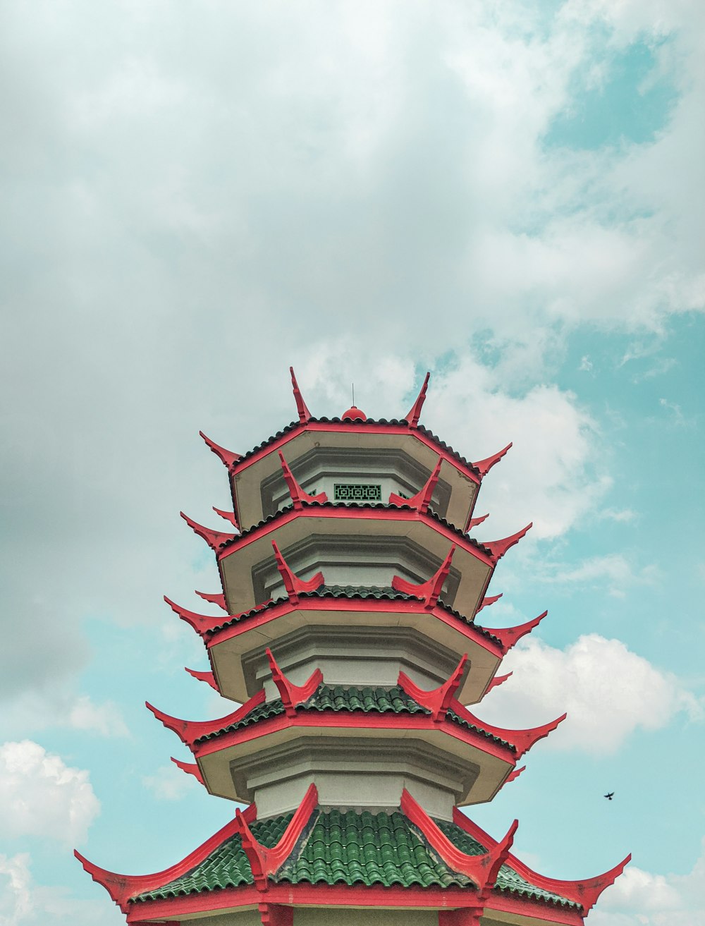 white and red concrete building under blue sky during daytime