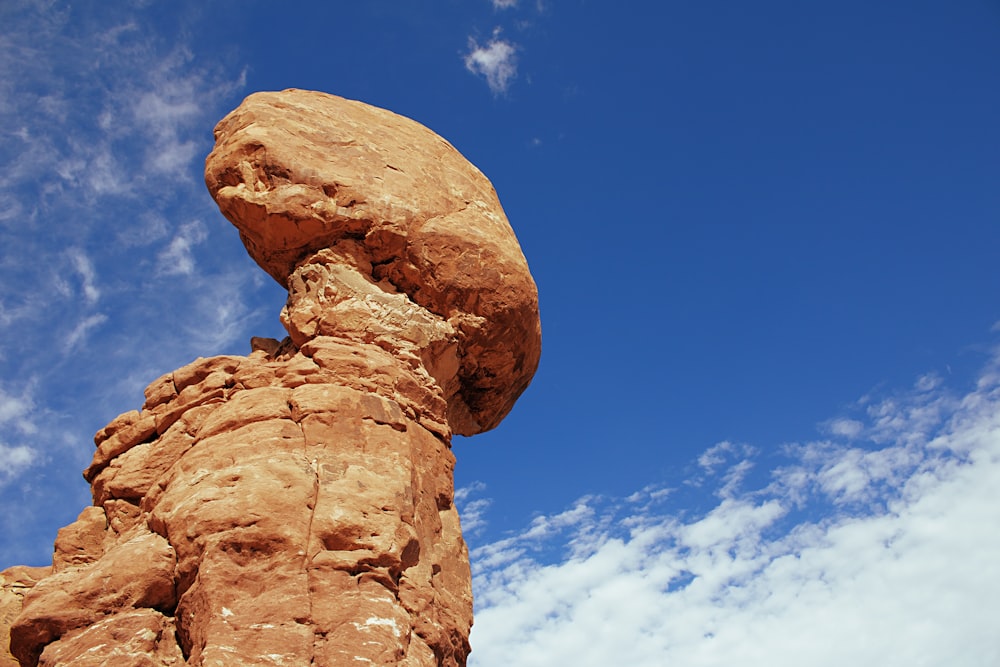 brown rock formation under blue sky during daytime