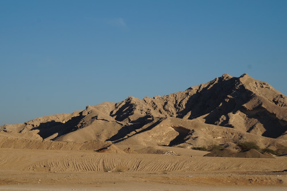 brown and gray mountains under blue sky during daytime