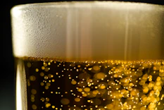 a close up of a glass of beer