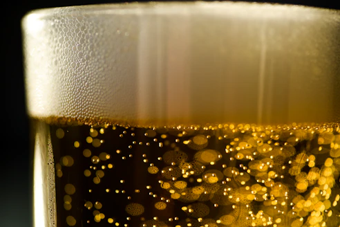 a close up of a glass of beer
