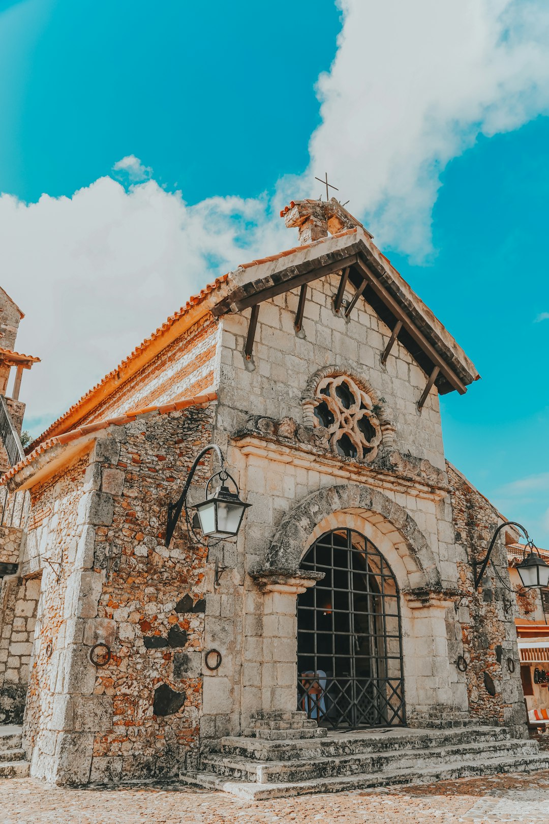 brown and white concrete church under blue sky during daytime