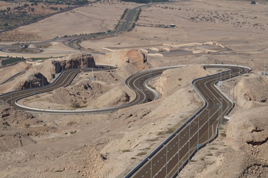 aerial view of brown field during daytime in Jebel Hafeet United Arab Emirates