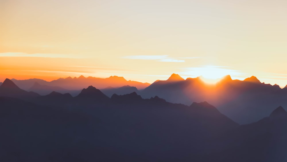 silhouette of mountains during sunset