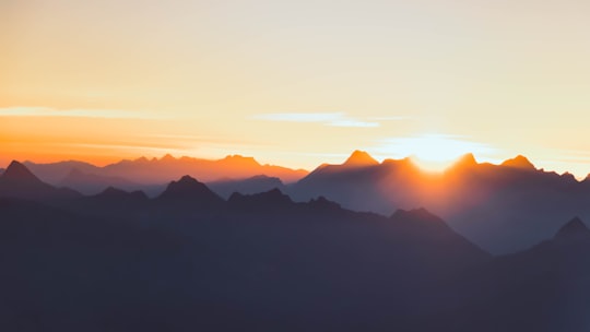 silhouette of mountains during sunset in Dent d'Oche France