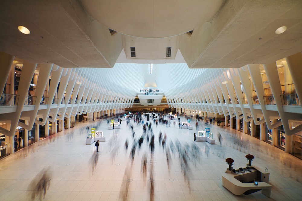 people walking inside white building