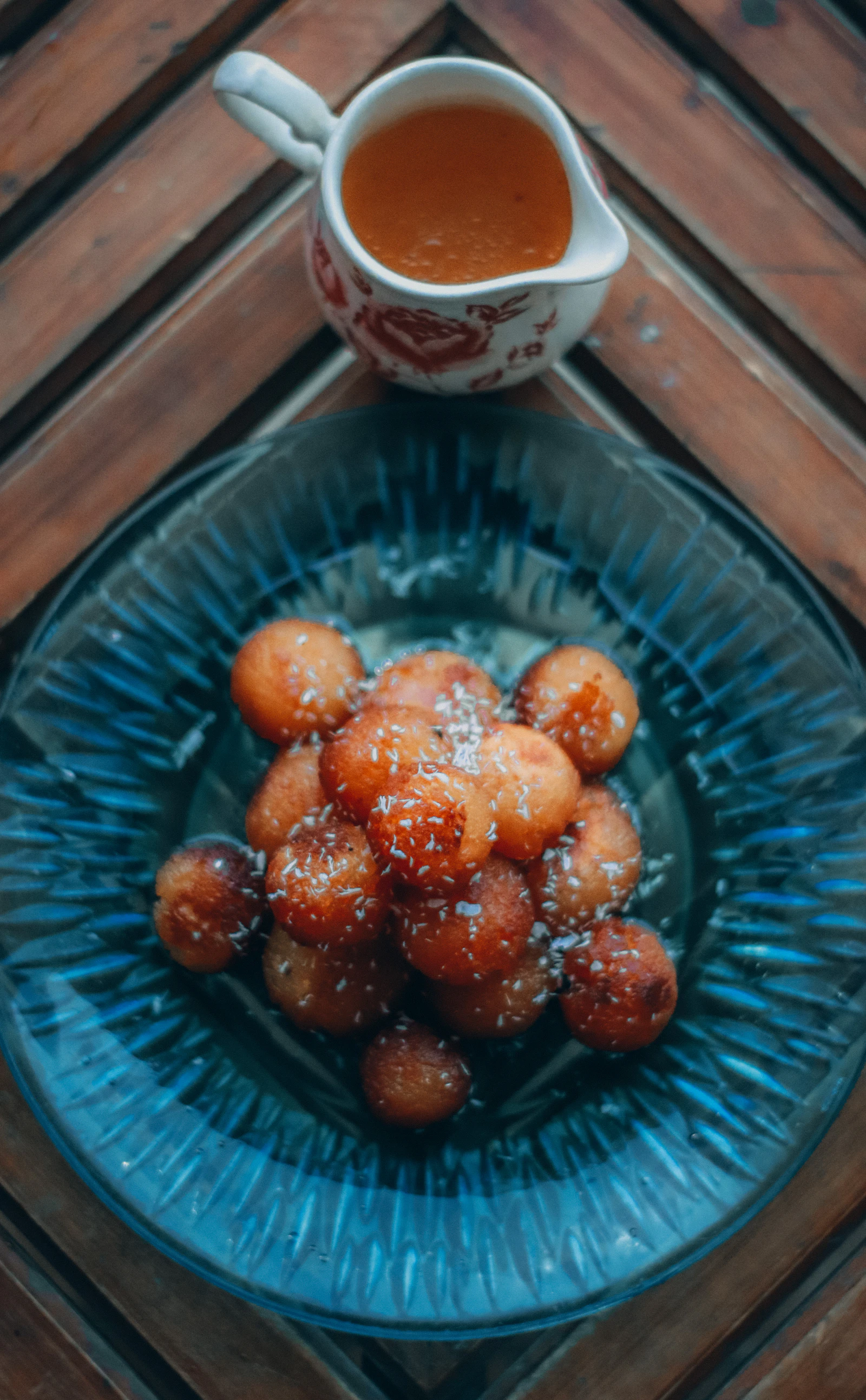 Gulab jamun served in a glass bowl