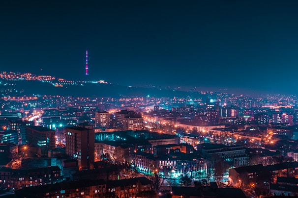 city with high rise buildings during night time